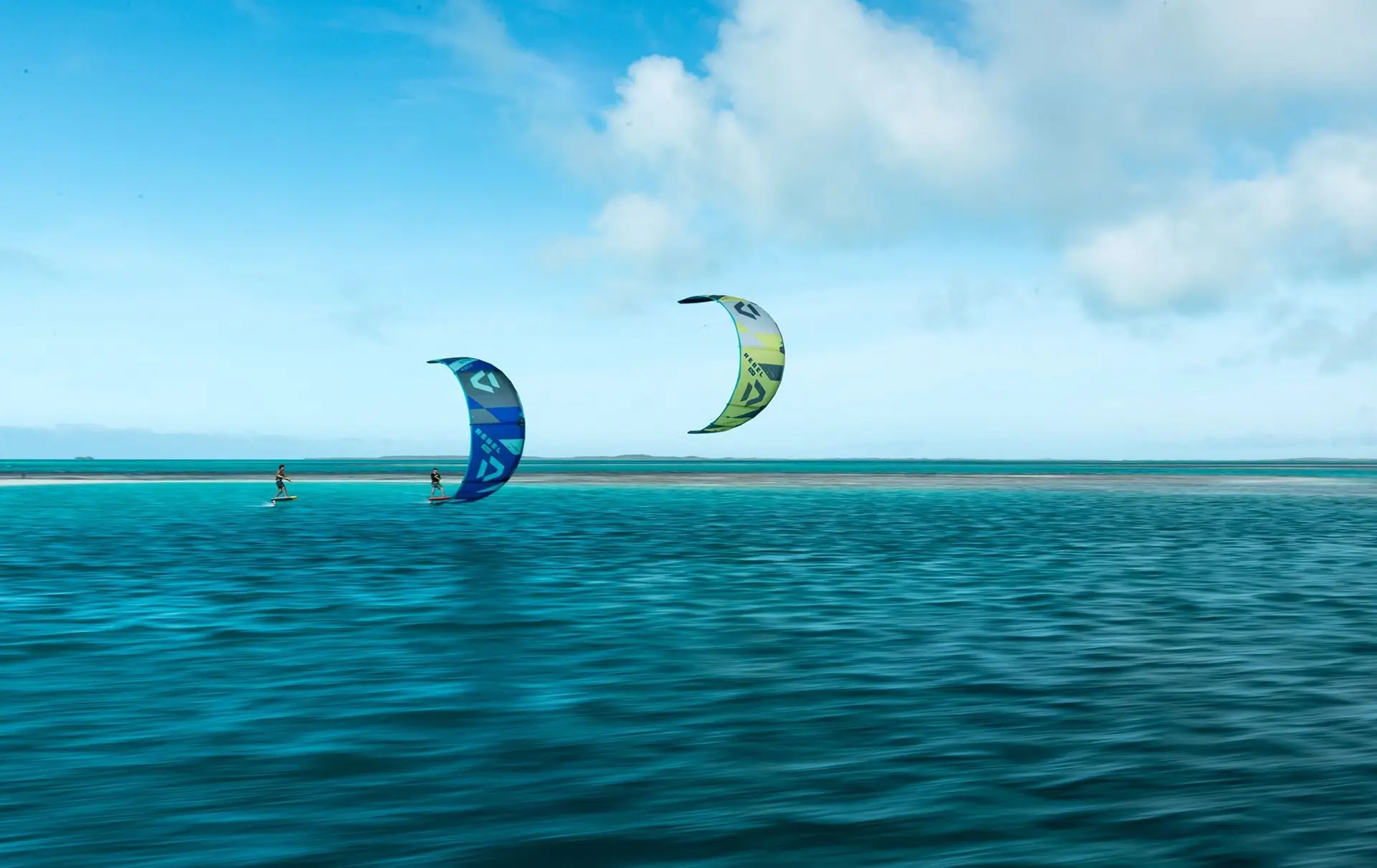 two kiter flying over blue water